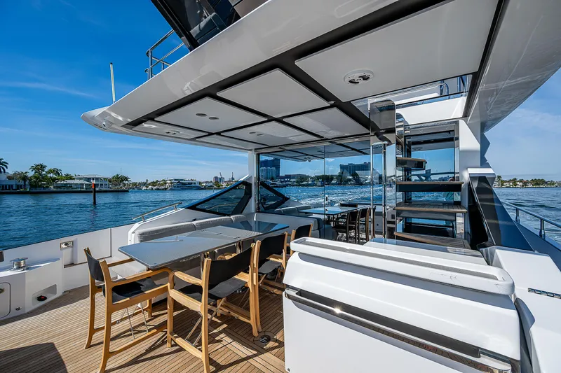 Slide: The Image of 2019 Azimut S7 yacht deck with dining area and ocean view. - 23