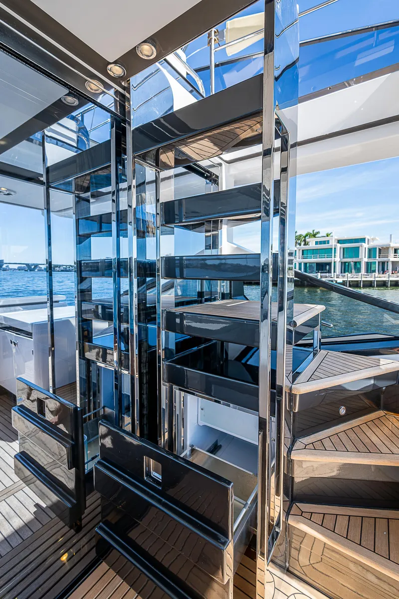 Slide: The Image of 2019 Azimut S7 yacht interior with modern staircase and waterfront view. - 26
