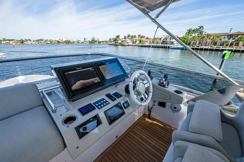 Slide: The Image of Cockpit of 2019 Azimut S7 yacht with modern navigation equipment and waterfront view. - 28