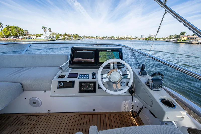 Slide: The Image of Luxurious 2019 Azimut S7 yacht helm with modern navigation system, overlooking serene waterfront. - 29