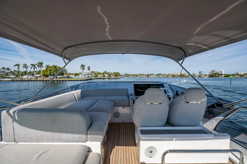 Slide: The Image of 2019 Azimut S7 yacht interior with seating, helm, and ocean view. - 33