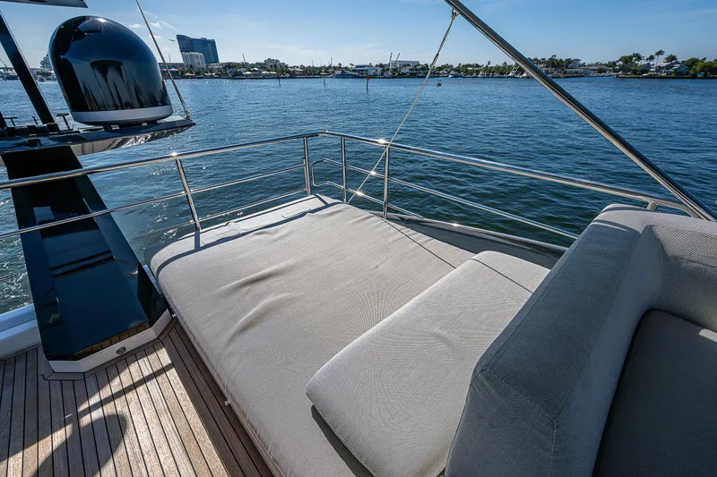 Slide: The Image of 2019 Azimut S7 yacht deck with sunbed overlooking calm waters. - 34