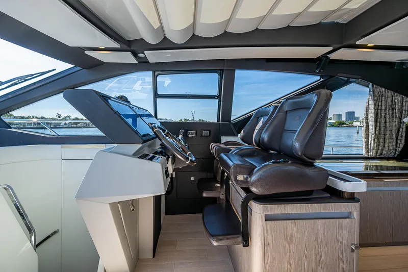 Slide: The Image of Interior of 2019 Azimut S7 yacht cockpit with modern controls and leather seating. - 43