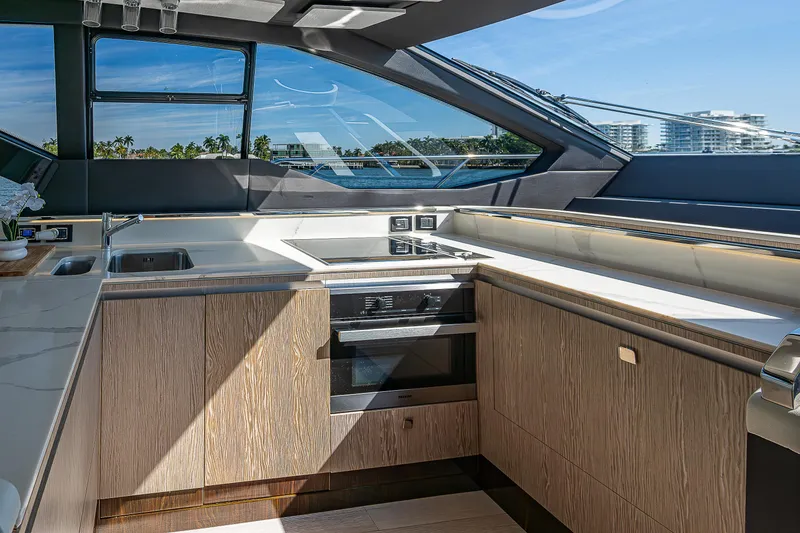 Slide: The Image of Luxurious kitchen interior of 2019 Azimut S7 yacht with modern appliances and scenic window view. - 46