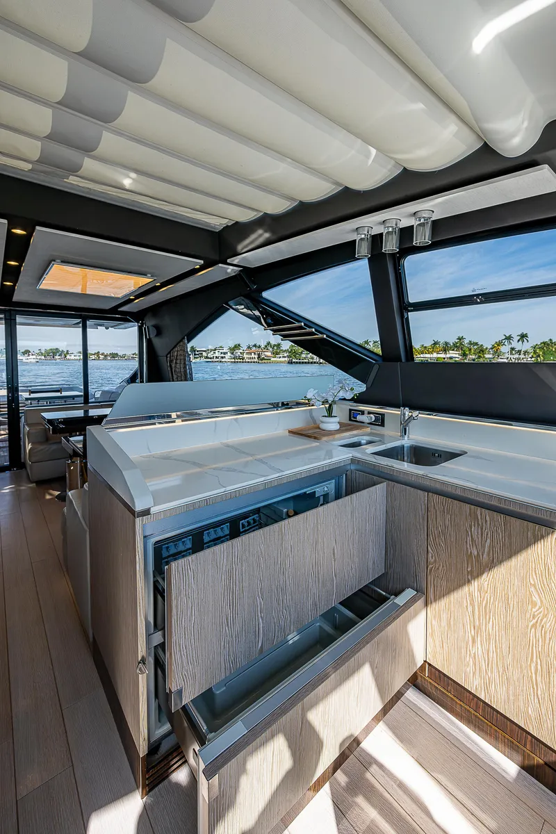 Slide: The Image of Luxurious interior of 2019 Azimut S7 yacht with modern kitchen and scenic water views. - 47