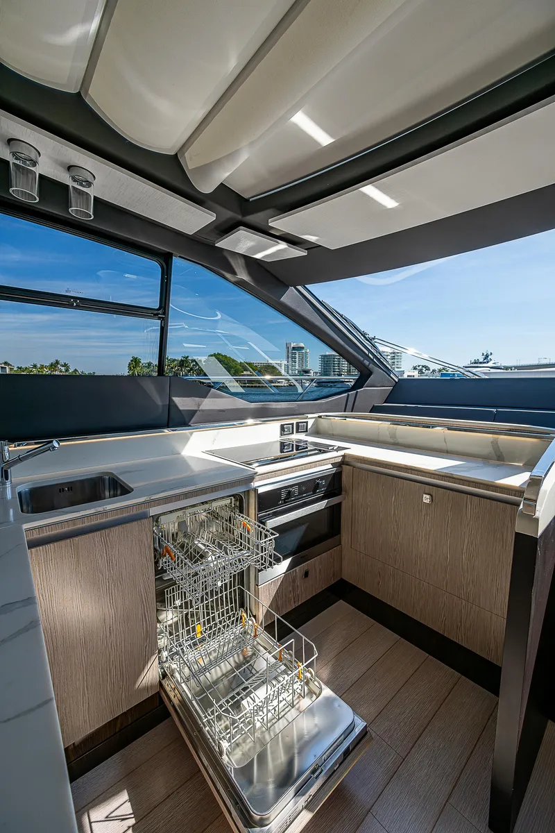 Slide: The Image of 2019 Azimut S7 yacht kitchen with modern appliances and open dishwasher. - 48