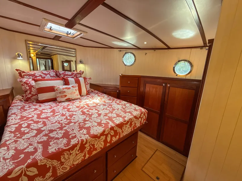Slide: The Image of Luxurious bedroom interior of 2001 Great Harbour GH37 yacht with elegant wood finish. - 37