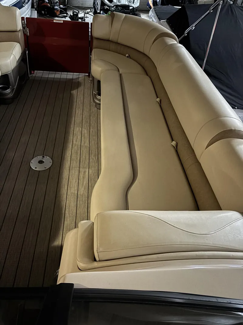 Slide: The Image of Luxurious seating on 2022 Avalon Excalibur Elite Windshield boat, featuring elegant beige upholstery. - 17