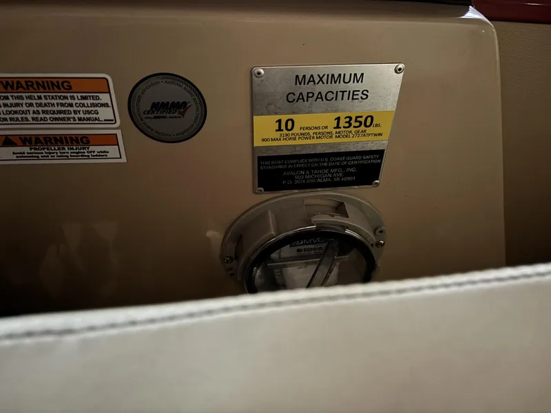 Slide: The Image of Maximum capacity warning label on 2022 Avalon Excalibur Elite Windshield boat. - 22
