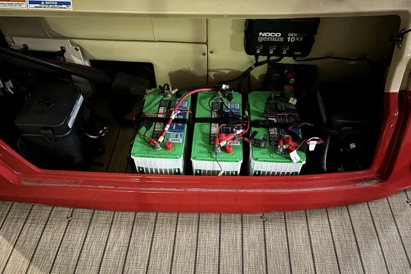 Slide: The Image of Battery compartment of 2022 Avalon Excalibur Elite Windshield with NOCO Genius charger. - 29