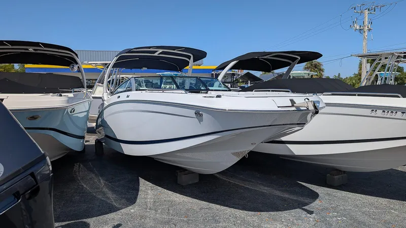 The Image of 2025 Four Winns HD8 OB boat displayed in a marina, showcasing sleek design and modern features. - 0