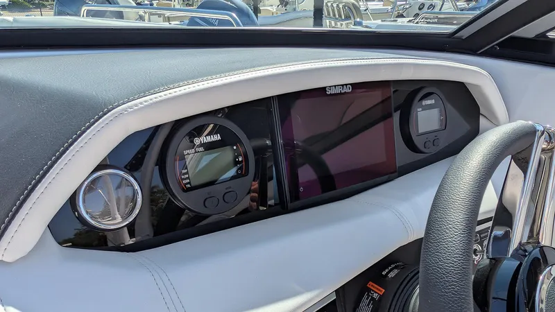 Slide: The Image of 2025 Four Winns HD8 OB dashboard with Simrad and Yamaha displays. - 14