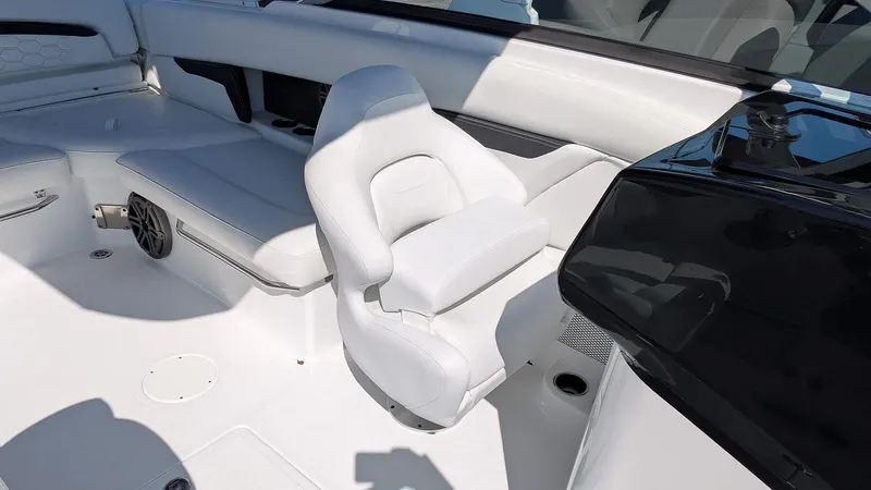 Slide: The Image of 2025 Four Winns HD8 OB boat interior with white seating and modern design. - 17