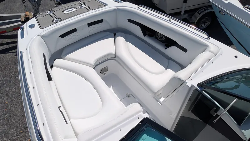 Slide: The Image of 2025 Four Winns HD8 OB boat with spacious white seating area. - 20