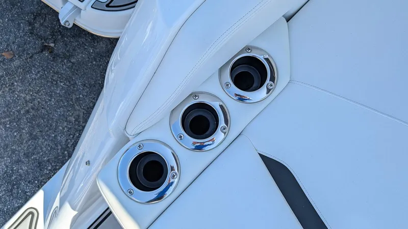 Slide: The Image of 2025 Four Winns HD8 OB boat with sleek white seating and chrome cup holders. - 5