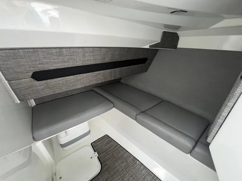 Slide: The Image of 2023 Cobalt A29 interior cabin with gray seating and modern design. - 13