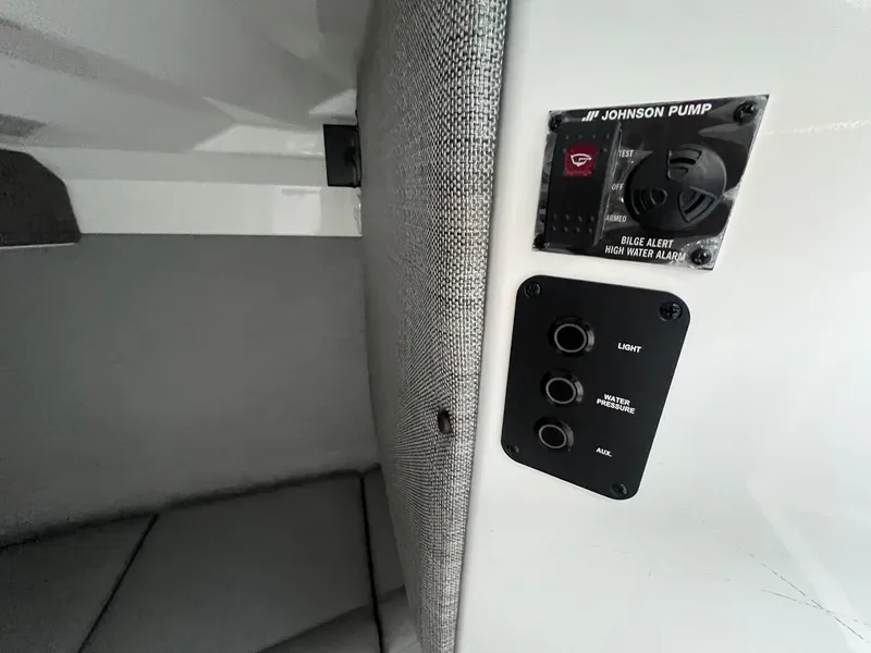 Slide: The Image of Control panel in 2023 Cobalt A29 boat with bilge alert and switches. - 14