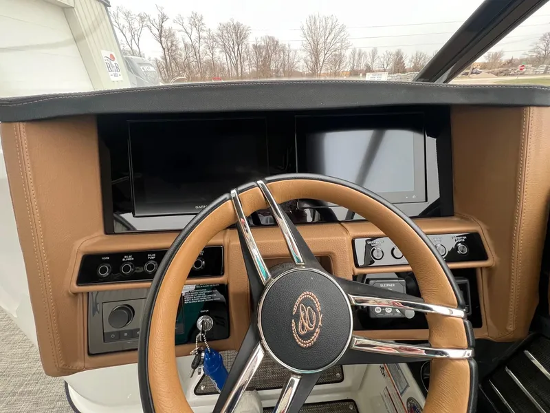 Slide: The Image of 2023 Cobalt A29 dashboard with dual screens and leather-wrapped steering wheel. - 15