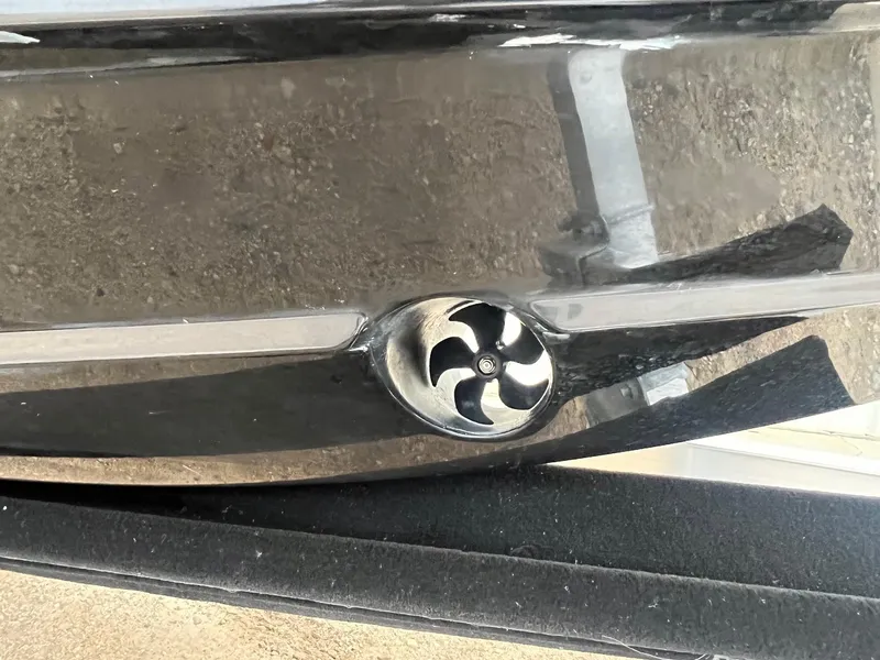 Slide: The Image of 2023 Cobalt A29 boat hull with a sleek, modern design and propeller detail. - 2