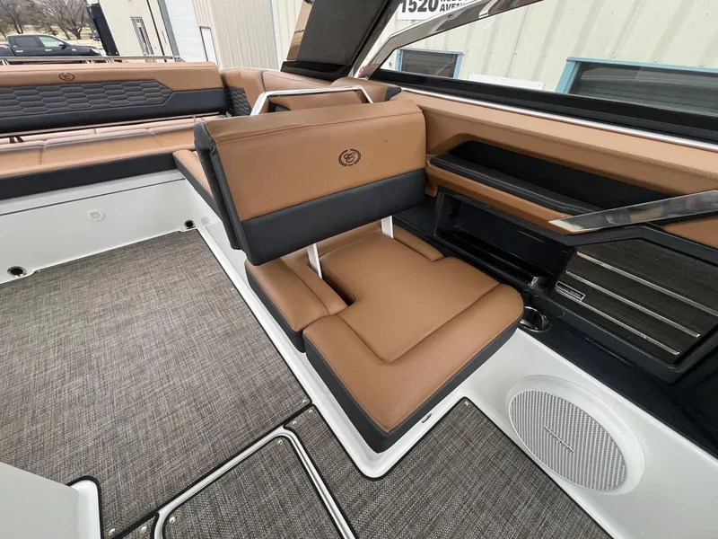 Slide: The Image of 2023 Cobalt A29 boat interior with tan leather seating and modern design. - 20