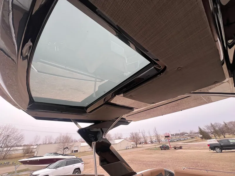 Slide: The Image of 2023 Cobalt A29 boat with sleek sunroof design and modern exterior. - 21