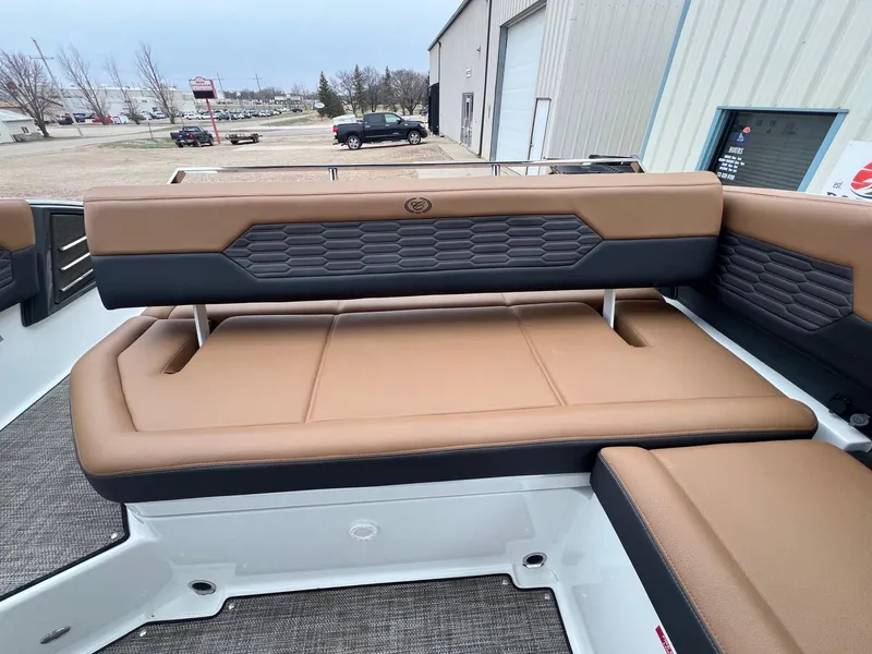 Slide: The Image of 2023 Cobalt A29 boat interior with tan and black seating, showcasing modern design. - 26