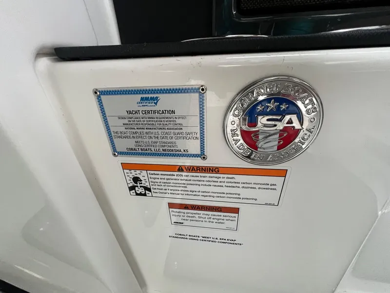 Slide: The Image of 2023 Cobalt A29 yacht certification and safety warnings displayed on the boat. - 28