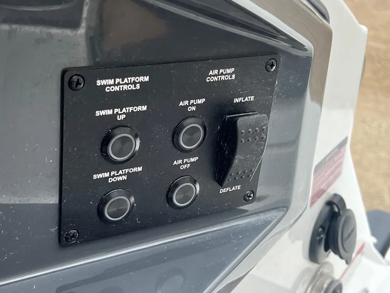 Slide: The Image of Control panel of 2023 Cobalt A29 boat with swim platform and air pump controls. - 36