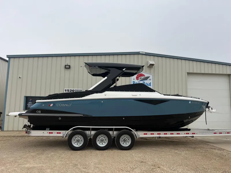 Slide: The Image of 2023 Cobalt A29 boat on trailer outside a building. - 40