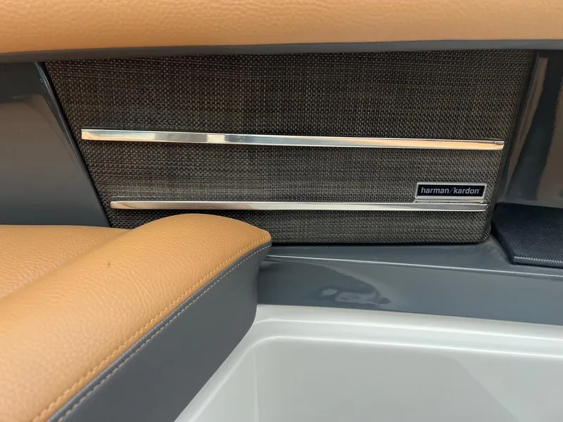 Slide: The Image of 2023 Cobalt A29 interior with Harman Kardon speaker and tan leather accents. - 8