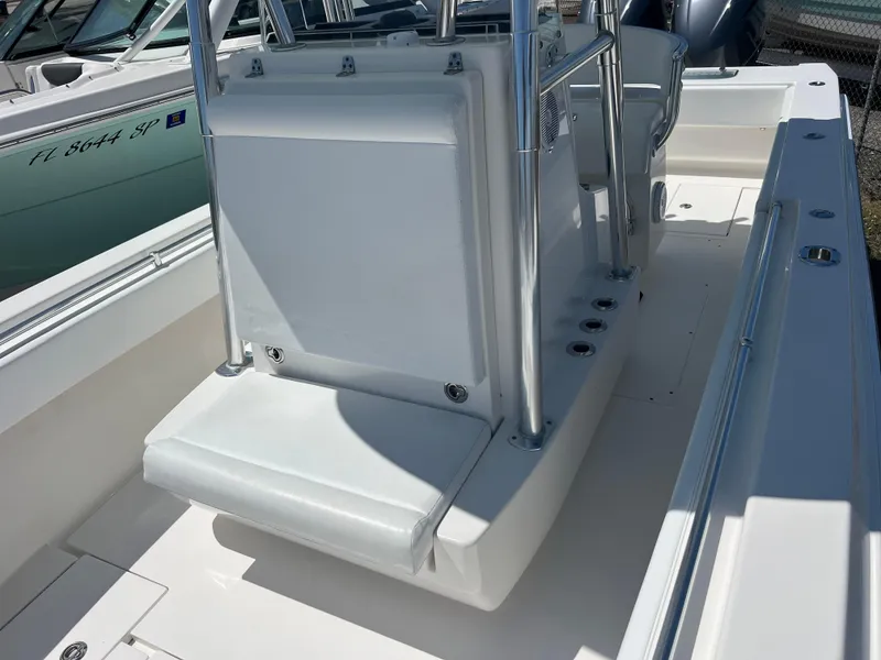 Slide: The Image of 2013 Contender 28 Sport boat interior with seating and console, showcasing sleek design and functionality. - 14
