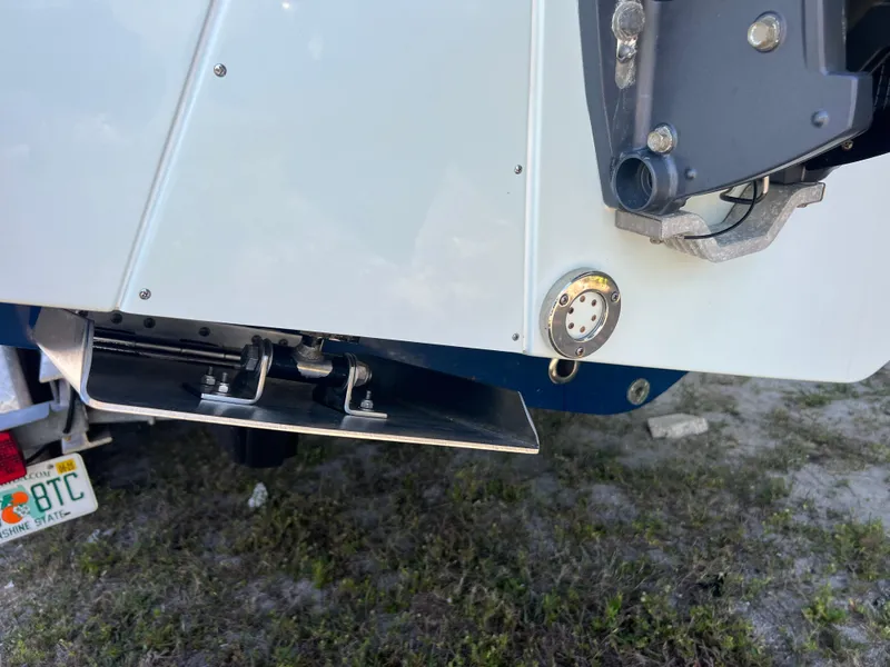 Slide: The Image of 2013 Contender 28 Sport boat stern with trim tab and motor mount. - 19