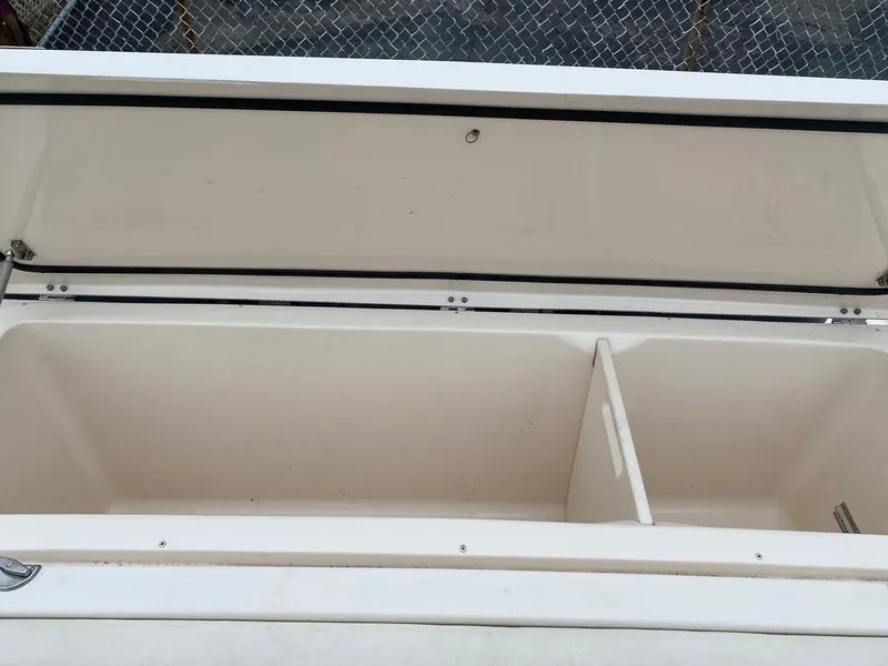 Slide: The Image of Open storage compartment on 2017 Grady-White Express 370 boat. - 10