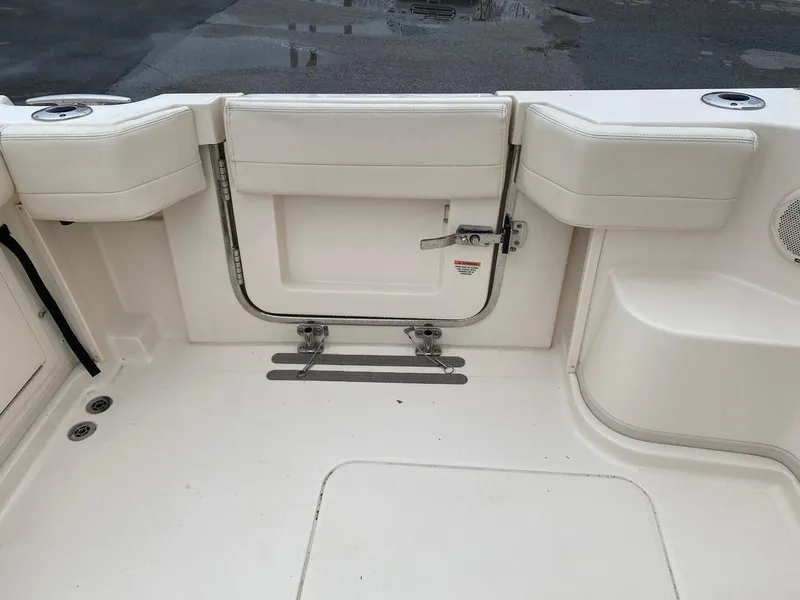 Slide: The Image of 2017 Grady-White Express 370 boat interior with white seating and storage area. - 13