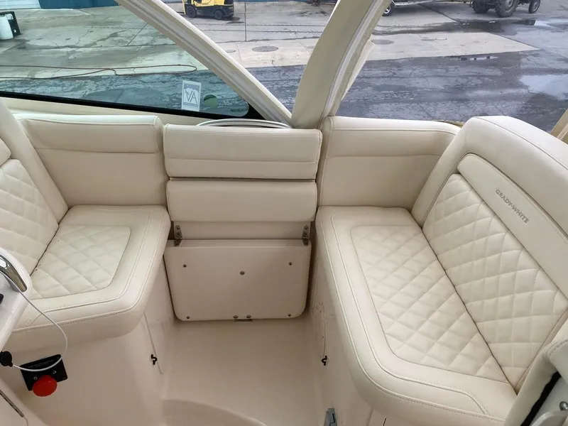 Slide: The Image of Luxurious seating area on a 2017 Grady-White Express 370 boat, featuring quilted upholstery. - 17