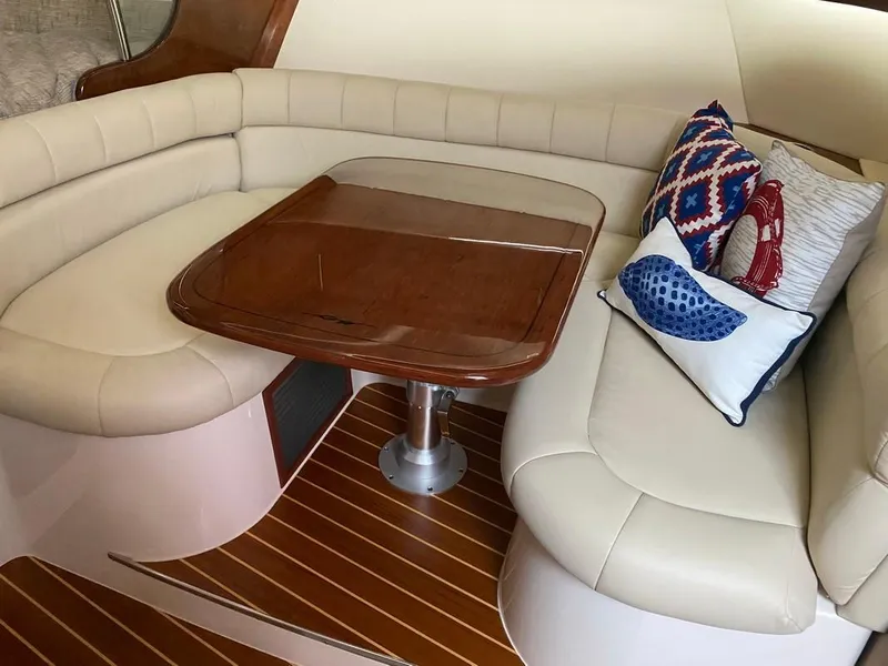 Slide: The Image of Luxurious interior of 2017 Grady-White Express 370 with plush seating and decorative pillows. - 20