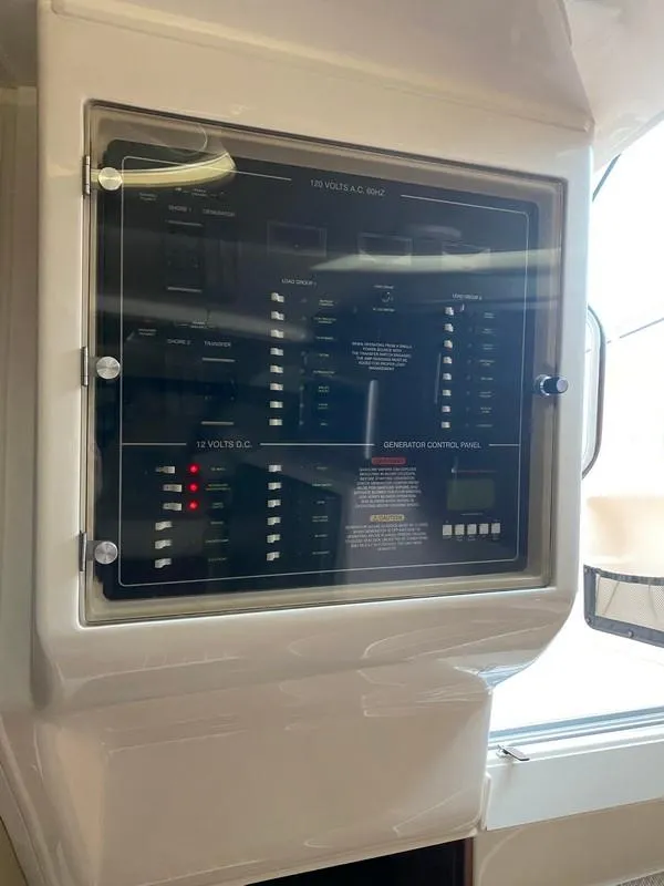 Slide: The Image of Control panel on a 2017 Grady-White Express 370 boat, featuring various switches and indicators. - 22