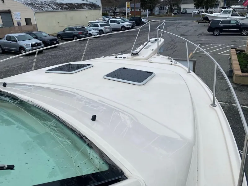 Slide: The Image of 2017 Grady-White Express 370 boat deck in a parking lot setting. - 23