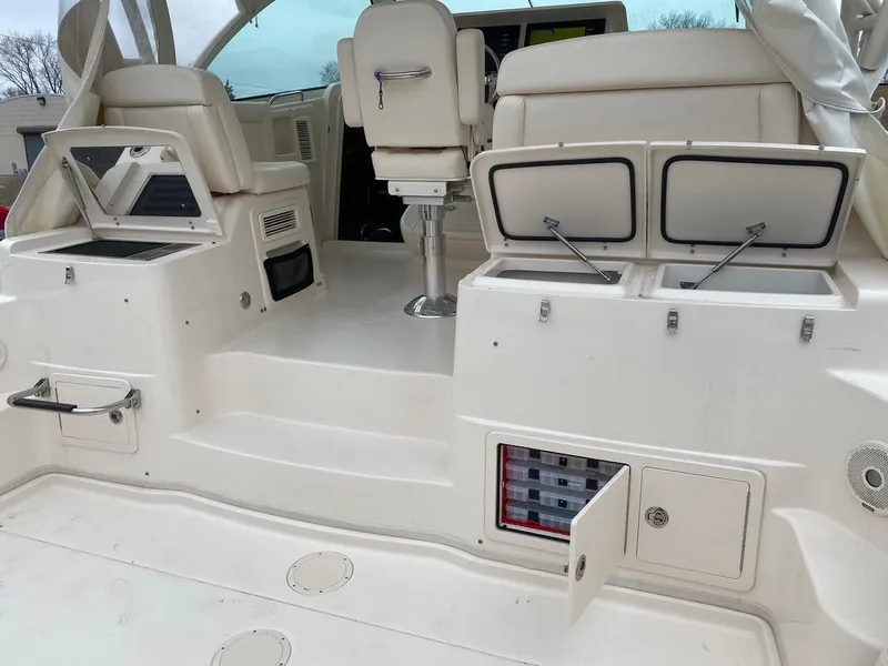Slide: The Image of 2017 Grady-White Express 370 boat interior with open storage compartments and seating. - 4