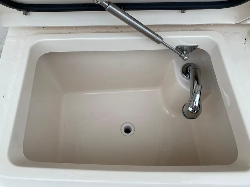 Slide: The Image of 2017 Grady-White Express 370 boat compartment with hydraulic lift and drainage. - 5