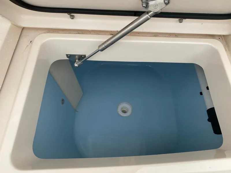 Slide: The Image of Livewell compartment on a 2017 Grady-White Express 370 boat, open and filled with water. - 6
