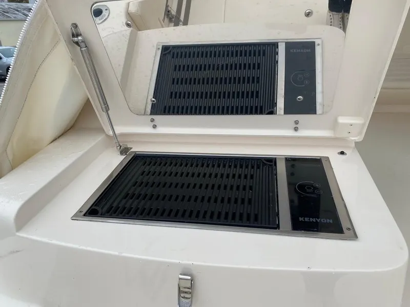 Slide: The Image of Outdoor grill on 2017 Grady-White Express 370 boat, featuring Kenyon electric cooktop. - 7