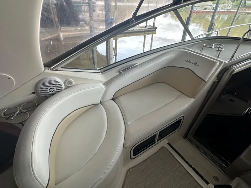 Slide: The Image of 2008 Sea Ray 260 Sundancer interior seating with cup holders and speaker. - 5