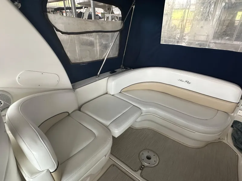 Slide: The Image of Interior seating of 2008 Sea Ray 260 Sundancer boat with white leather upholstery. - 6