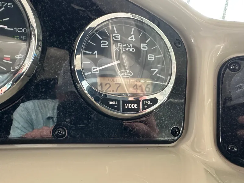 Slide: The Image of Close-up of 2008 Sea Ray 260 Sundancer RPM gauge displaying 127.4 hours. - 7