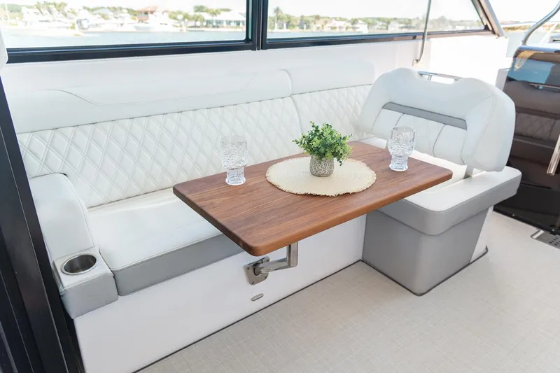 Slide: The Image of Flat-screen TV in 2026 Regal 36 XO yacht interior, mounted on light wood paneling. - 14