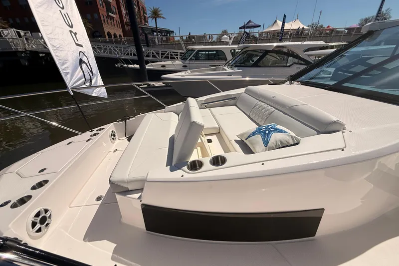Slide: The Image of Luxurious 2026 Regal 36 XO boat interior with plush seating and starfish-themed decor. - 51