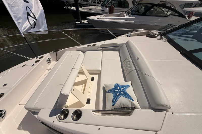 Slide: The Image of Luxurious seating area on 2026 Regal 36 XO yacht with starfish pillow. - 53