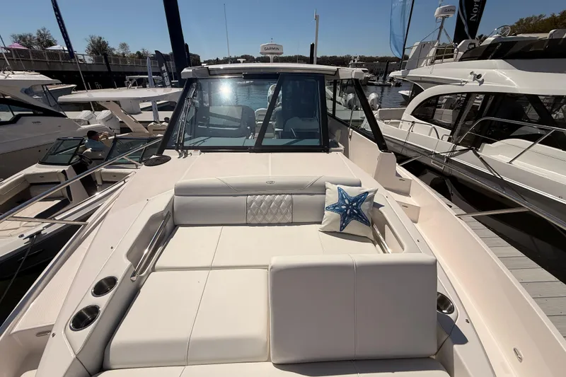 Slide: The Image of 2026 Regal 36 XO yacht with luxurious seating and starfish pillow on deck. - 55