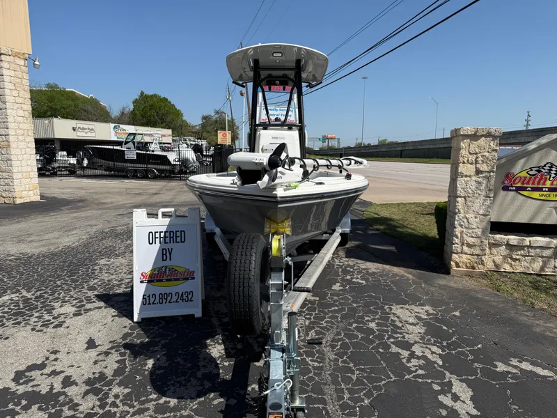 Slide: The Image of 2025 Pathfinder 2300 HPS boat on trailer, displayed outdoors at dealership. - 13
